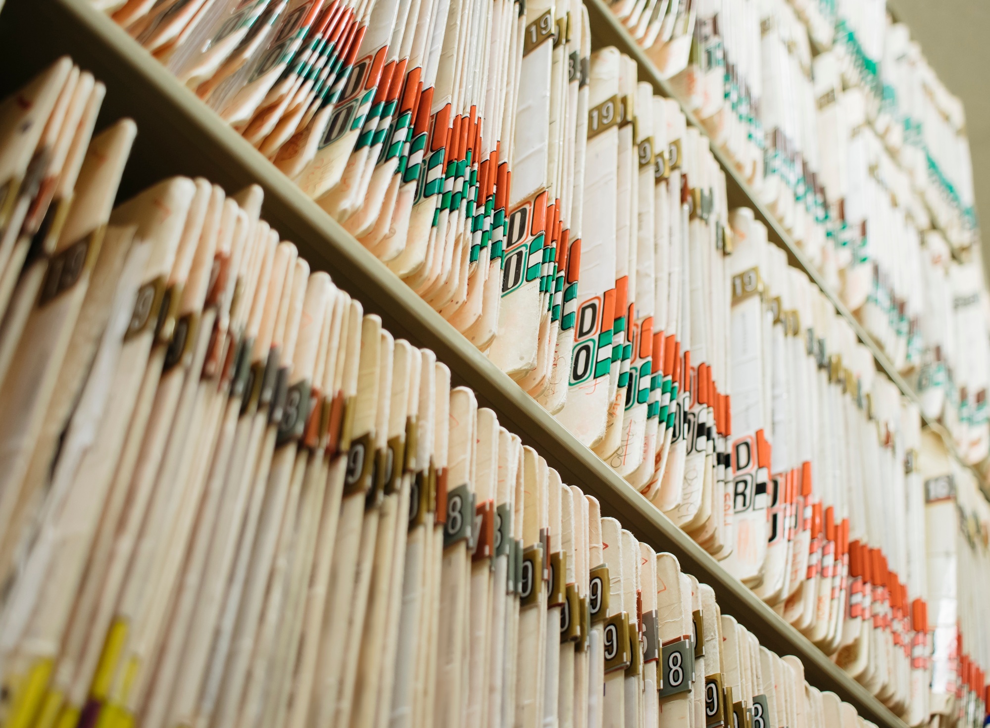 Room filed with shelves of medical records, folders