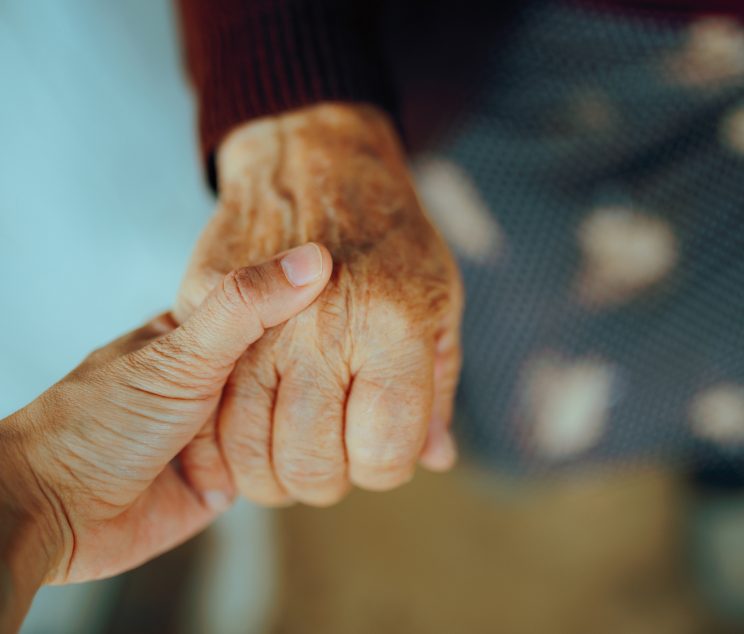 Mature lady being comforted with empathy in her golden years